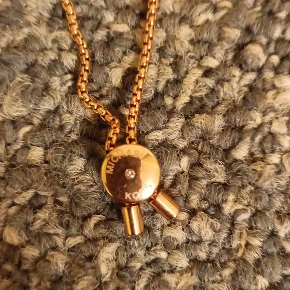 Michael Kors rose gold rhinestone zip bracelet
